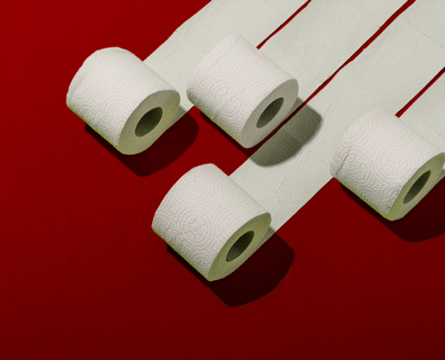 Rouleaux de papier toilette sur fond rouge
